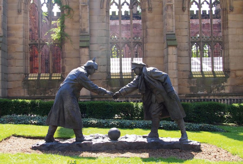 Two soldiers from different countriesshaking hands